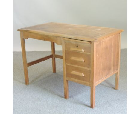 An early 20th century light oak desk, 107cm