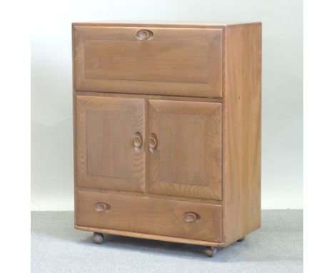 An Ercol light elm drinks cabinet, 82cm