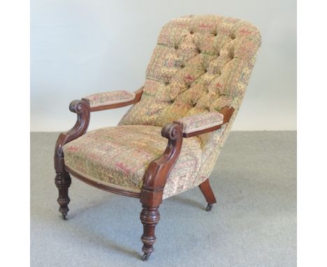 A Victorian floral upholstered button back armchair 