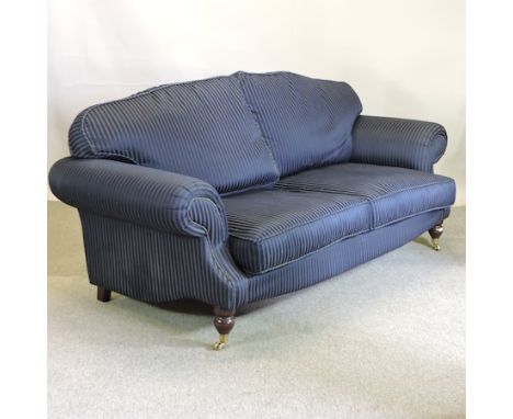 A dark blue stripe upholstered two seater sofa on turned legs, 204cm