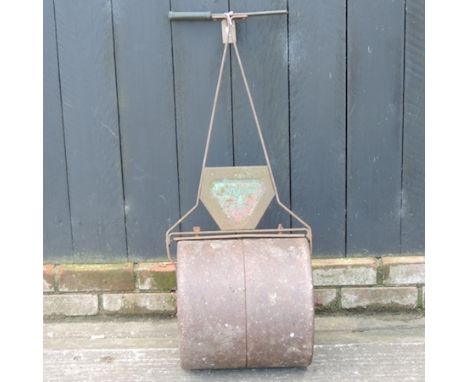 An iron garden roller, together with a green glazed planter, 28cm tall