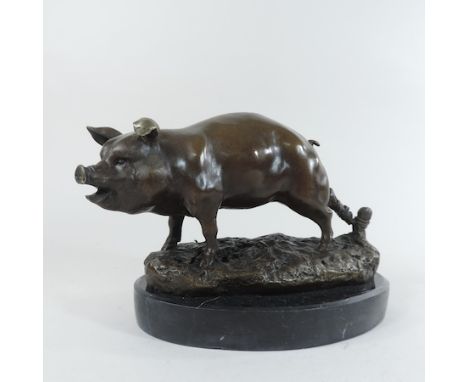 A bronze model of a pig, 16cm tall