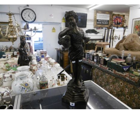 A BRONZE LADY WITH BASKET