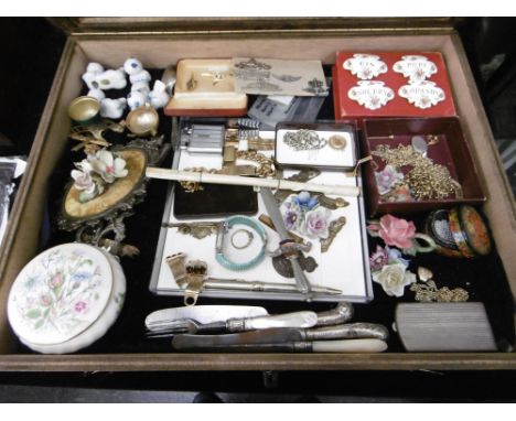 A DISPLAY CABINET WITH MIXED ASSORTMENT OF ITEMS INCLUDING ENAMEL WINE LABELS, CAP BADGES ETC