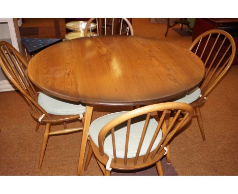 Ercol dining table and four chairs in beech and elm 