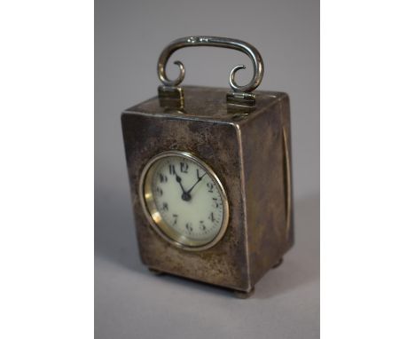 A Silver Cased Miniature Carriage Clock by The Goldsmiths and Silversmiths Company, Regent Street. White Enamel Dial and Four