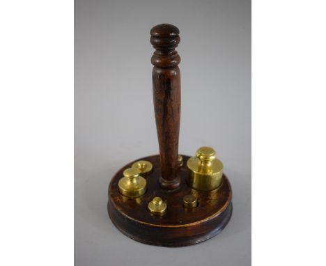 A Set of Six French Graduated Brass Scale Weights Set in Circular Wooden Plinth with Turned Wooden Handle