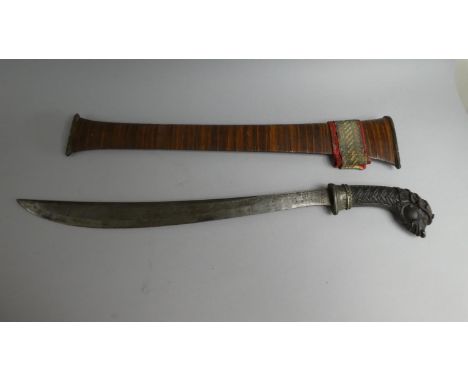 A Nice Quality Far Eastern Short Sword with Finely Carved Grip and Lion Mask Pommel. Slightly Curved Blade. (40cms Long) Wood