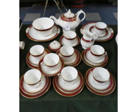 A Collection of Red and Gilt Tea Service to include Six Trios, Three Saucers, Three Cups Two Cake Plates, Cream, Sugar and Te