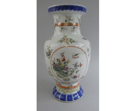 A 19th Century Chinese Vase decorated with Poultry, Wild Birds and Flowers. Underglazed Seal Mark to Base. 27cms High 