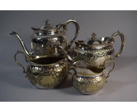 A Victorian Silver Plated Four Piece Tea Service with Embossed Fruit Decoration. 