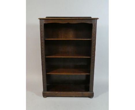 An Edwardian Oak Four Shelf Open Bookcase with Carved Supports