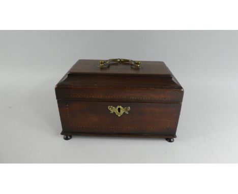 An 18th Century George III Mahogany Tea Caddy with a Brass Carrying Handle over Shaped Top and Sides with Ebony and Boxwood C