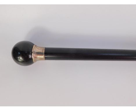 An ebonised walking stick with a black pearl ball knop, No 8, silver ferule,  83.5cm long.