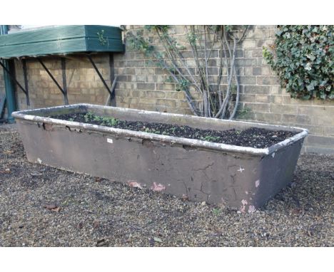 A cast iron oblong trough, 32cm x 68cm x 122cm.Viewing & Collection: Viewing is online only from imagery and descriptions pro