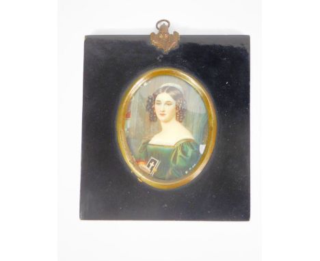 Continental School.  Miniature on ivory portrait of a lady holding a prayer book, verso titled Miss Hillmayr, signed Dumas, 8