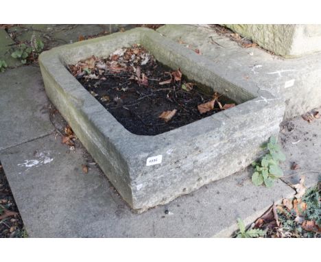 A rectangular stone hand hewn water trough, 18cm x 77cm x 46cm.Viewing & Collection: Viewing is online only from imagery and 