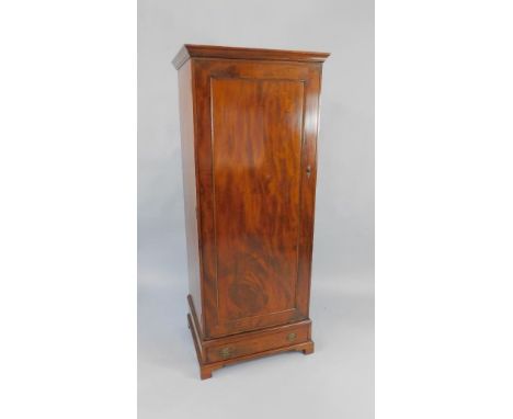 An Edwardian mahogany wardrobe, the outswept pediment over a single door and drawer, raised on bracket feet, 66cm x 56cm x 17