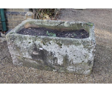 A hand hewn rectangular stone trough, 46cm x 105cm x 60cm.Viewing & Collection: Viewing is online only from imagery and descr