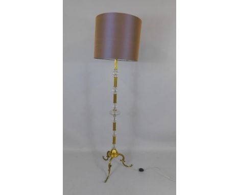 A Continental 20thC brass and cut glass standard lamp, with shade, 180cm high.