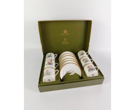 A Royal Worcester porcelain botanical part coffee service, comprising six cans and saucers, boxed.