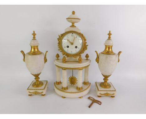 A French late 19thC white marble and gilt brass matched clock garniture, the demi lune clock with barrel case, enamel dial be