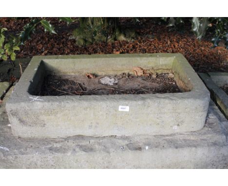 A rectangular stone hand hewn water trough, 17cm x 77cm x 45cm.Viewing & Collection: Viewing is online only from imagery and 