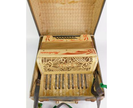 A Mantovani accordian, twenty four button, cased.