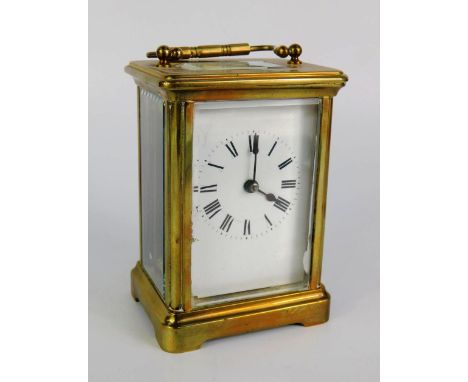 A brass cased carriage clock, enamel dial bearing Roman numerals, 8cm x 6cm x 11.5cm., (AF).