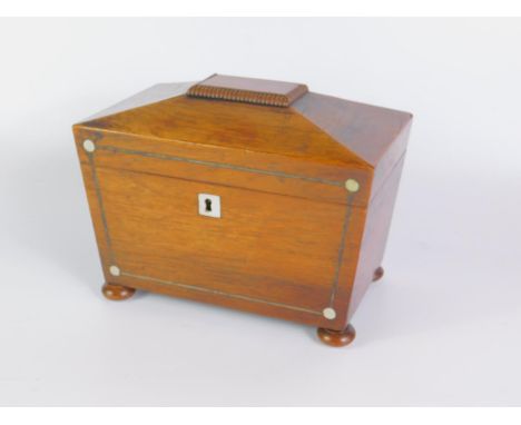 A Regency rosewood sarcophagus tea caddy, with mother of pearl and wire inlay, twin compartments, raised on bun feet, 21.5cm 