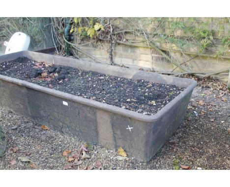 A rectangular cast iron trough, 31cm x 68cm x 180cm.Viewing & Collection: Viewing is online only from imagery and description