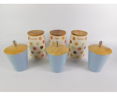 Three vintage pottery storage jars, decorated in a multi coloured polka dot pattern, with wooden lids, for Coffee, Sugar and 