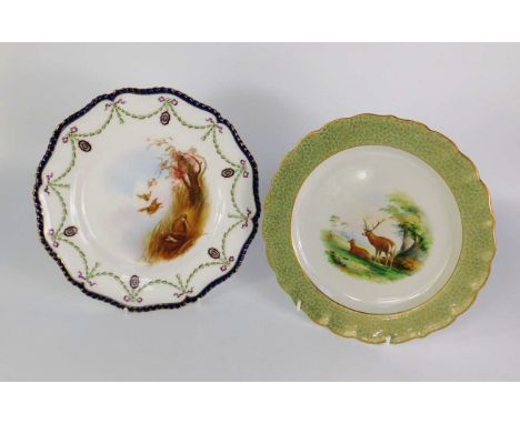 A Royal Worcester porcelain dessert plate, circa 1902, painted with deer in a clearing, within a green and gilt floral border