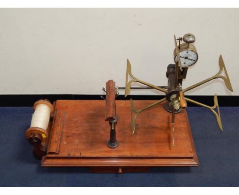 A Victorian brass and steel wool winder with tension tester by J Nesbitt, late Walker, Manchester, the enamel dial with bell 