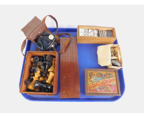 An early 20thC Staunton type wooden chess set, Globe series draughtsmen, bone and ebony dominoes, all boxed, cribbage board, 