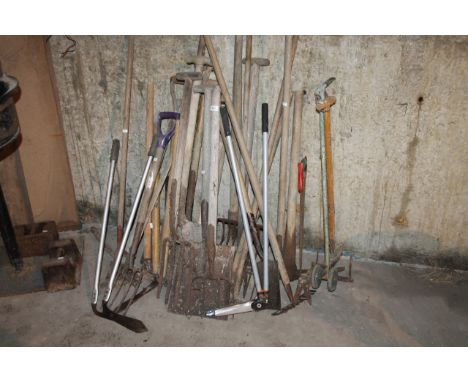A quantity of garden tools, farm tools and sundry items, to include rakes, pitch forks, pick axe, shears, etc.To be viewed on