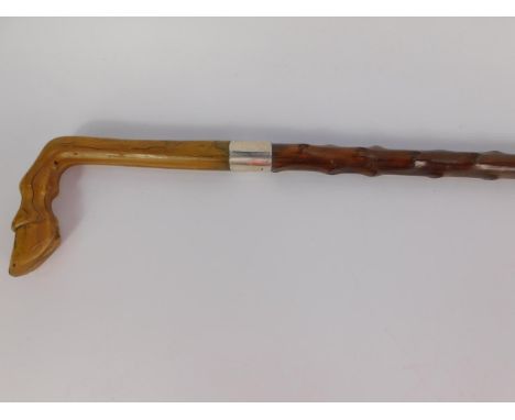 An Edward VII wooden and horn handled walking stick, carved as an antelope's foot, with a silver collar ferule, Birmingham 19