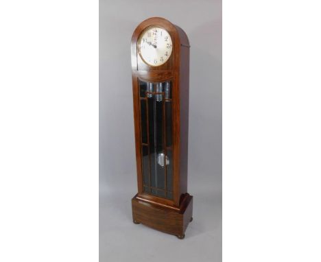 An Enfield early 20thC walnut cased grandmother clock, circular silvered dial bearing Arabic numerals, strike silent lever, t