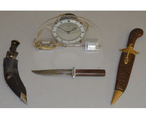 An Art Deco Ferranti mantle clock together with 3 ornamental daggers.