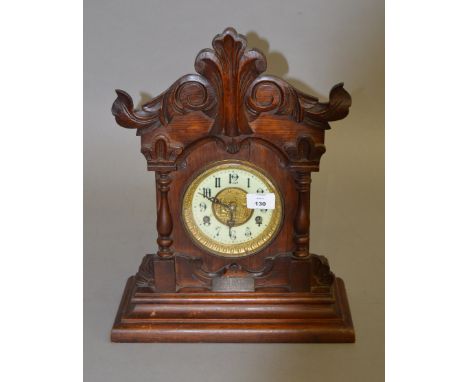 A Victorian wooden cased chiming mantle clock with key and pendulum. Plaque to front reads "Presented To Their Father By His 