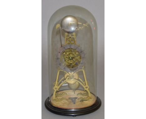 A skeleton clock with glass dome. 40cm high with dome.