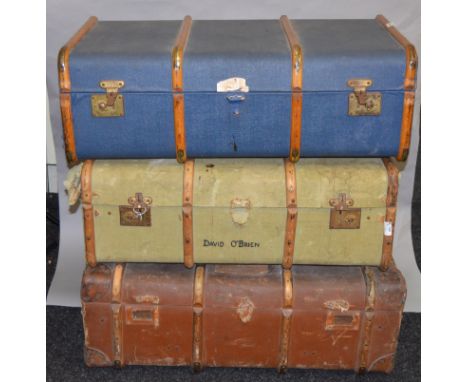 4 Large vintage travel or steamer trunks including a Never Break wooden example.