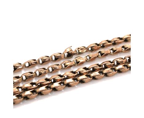 A VINTAGE TULIP STYLE CHAIN, UNHALLMARKED AND ASSESSED AS 9ct GOLD. LENGTH 78cms. WEIGHT 14.7grms. 