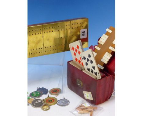 A RED LEATHER CASED PAIR OF MUDIES GAMES MARKERS AND PLAYING CARDS, A COLLECTION OF ENAMEL TENNIS BADGES, A BOX OF TWO PELHAM