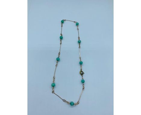 A Jade and Gold necklace 