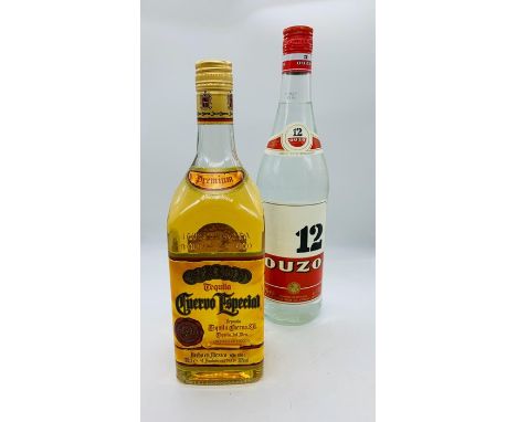 A bottle of Cuerro Tequila 1litre and a bottle of Ouzo 12 1litre