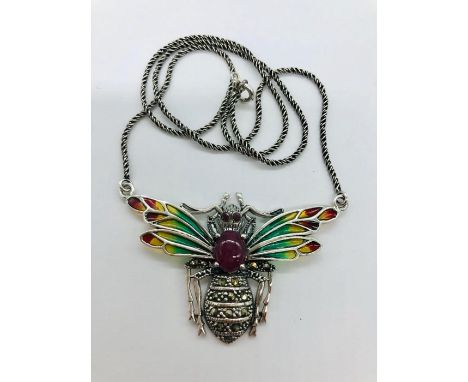 A silver plique a jour necklace with ruby cabochon 