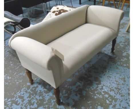 SOFA, of small proportions, in neutral fabric on turned supports, 134cm L.