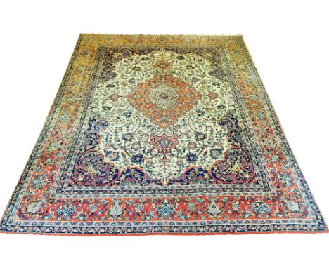 ANTIQUE ISPHAHAN CARPET, 347cm x 265cm, central medallion on an ivory field within corresponding spandrals and borders. 