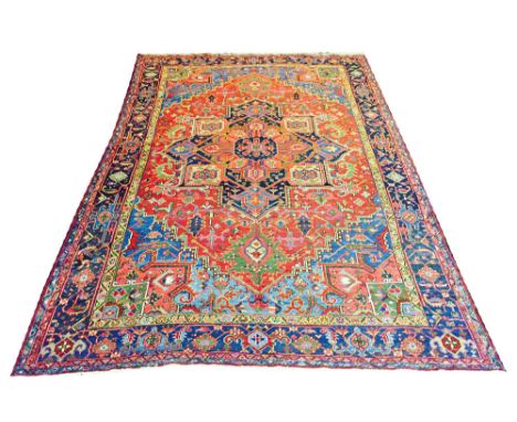 ANTIQUE HERIZ CARPET, 360cm x 230cm, star medallion on a terracotta field of stylised palmettes and vines within sky blue spa